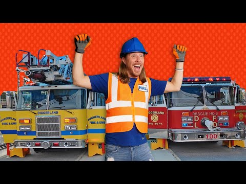 Confident man in a blue hard hat and orange safety vest standing in front of two fire trucks, arms raised in celebration.