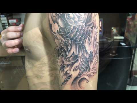 Xăm hình cá chép trên bắp tay tại Thủ Đức - Tattoo Trần Kỹ