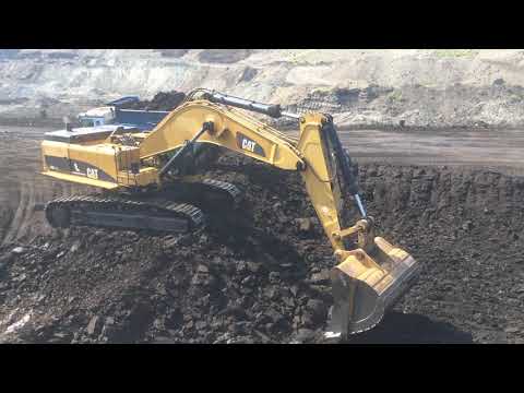 Caterpillar 385C Excavator Loading Coal At Trucks