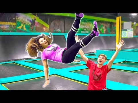 TEACHING HER TO BACKFLIP ON TRAMPOLINE!! (GONE WRONG)