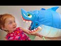 DON'T GET CAUGHT!! Adley reviews Shark Bite pool toy with Mom (mystery guest)