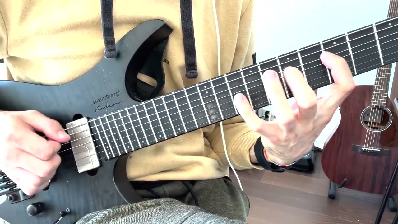 Guitarist demonstrating a string skipping pentatonic lick on electric guitar