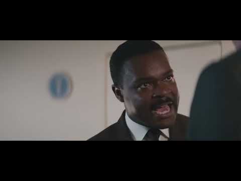 Trailer close-up: Dr. King at the pulpit, eyes up, room hushed