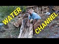 Attempting To Get Spring Water To Flow Through Channel Of A Hollow Log To Create A Waterfall