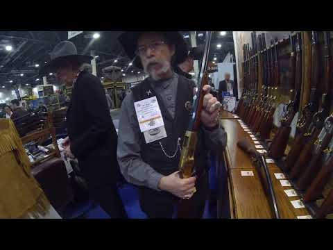 learning about cowboy rifles at the Cimarron booth shot show Las Vegas