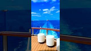 A perfect cruise day at sea under blue skies and happy sunshine.
