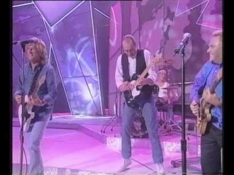 Freddie Starr performing Rocking All Over The World with Status Quo