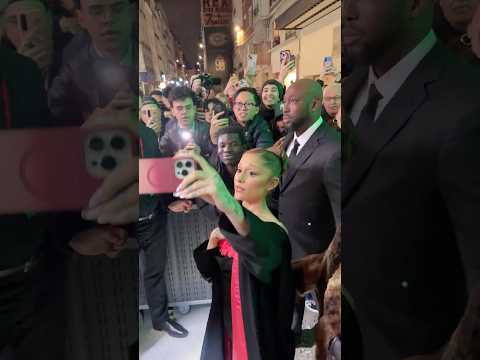 Ariana Grande showing all the love to fans at the Paris screening