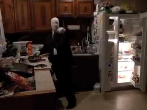 slenderman cooking hotdogs on the stove