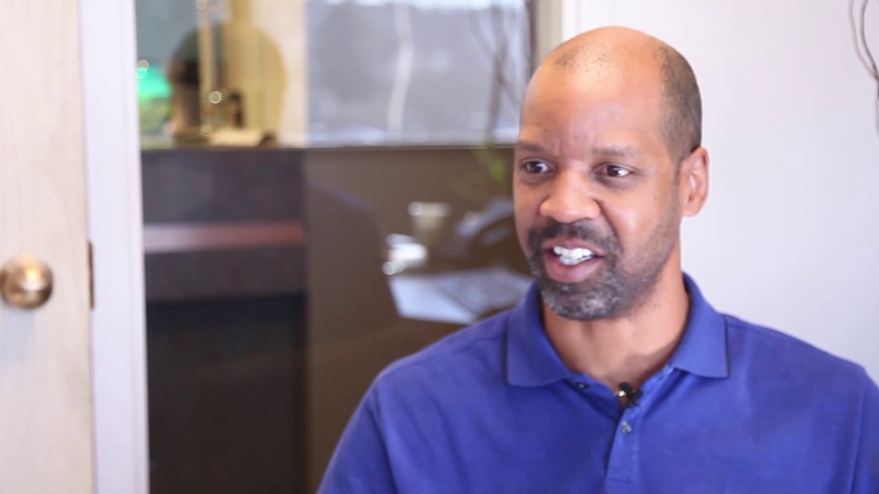 Man in blue polo shirt in Colorado Springs dental office