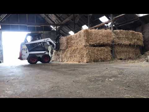 Stacking straw bales with a bobcat