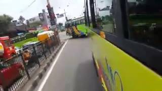 A Mass Entry of Four Kings of Green Kerala Tourist Bus.