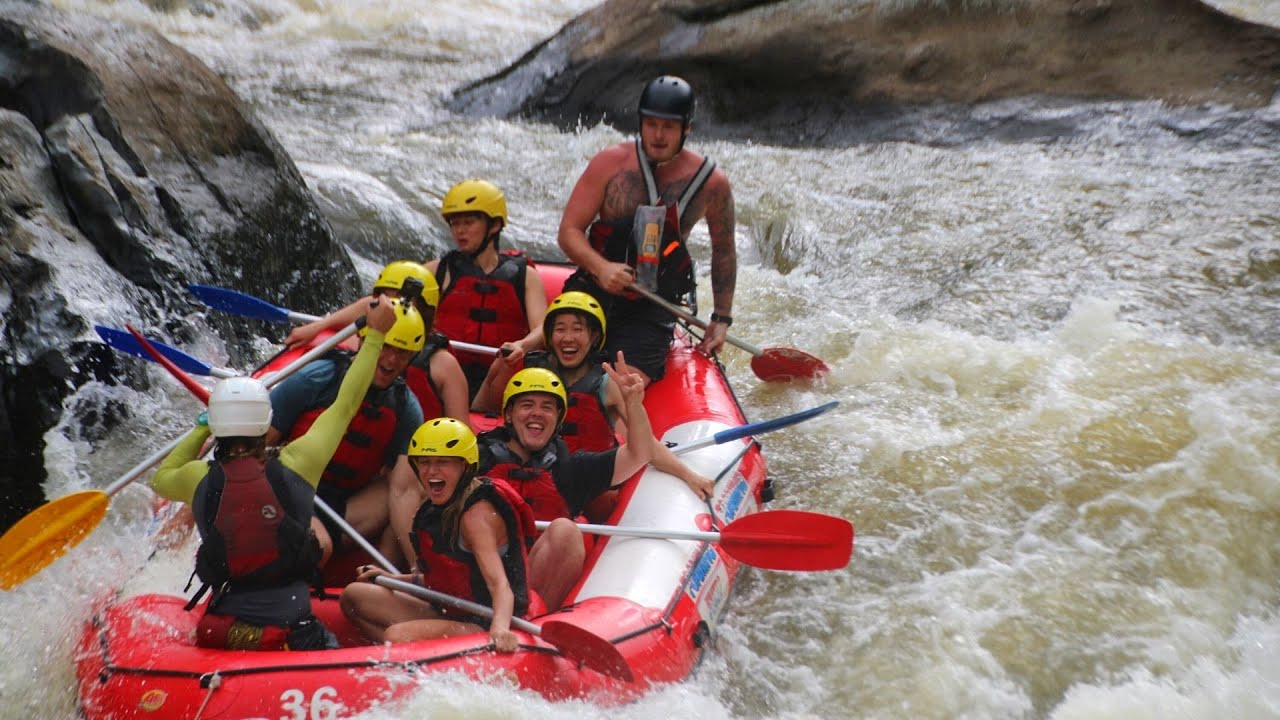 A duo participates in white river rafting adventure.