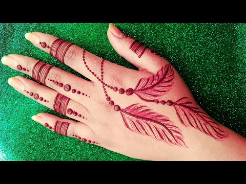 stylish feather tattoo style mehndi design for back hand by india super henna