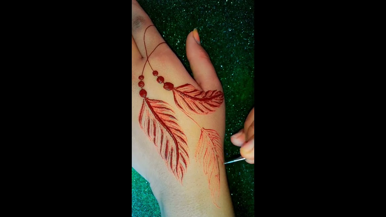 stylish feather tattoo style mehndi design for back hand by india super henna