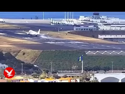 Plane bounces off runway while battling strong winds
