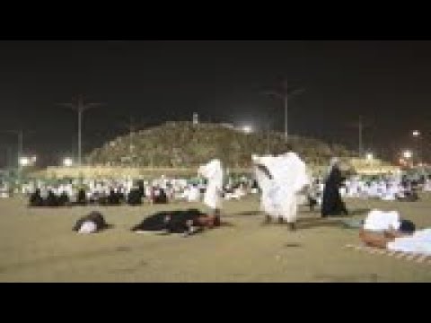 Hajj pilgrims prepare to pray at Mount Arafat