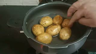 How manywhistles does it take to boil potatoes in pressurecooker?
