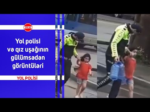 Yol polisi və qız uşağının gülümsədən görüntüləri