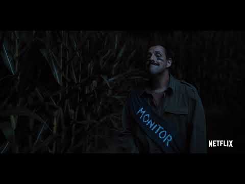 Hubie Halloween (2020) official trailer still: Hubie cycles through Salem with a thermos at the ready