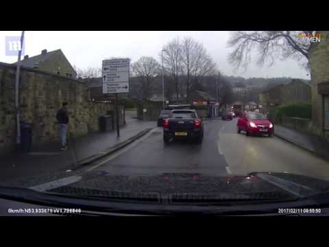 Pedestrian throws HIMSELF at passing car in Huddersfield
