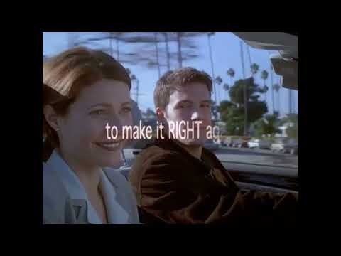 Bounce trailer frame—rain-specked windshield, city blur