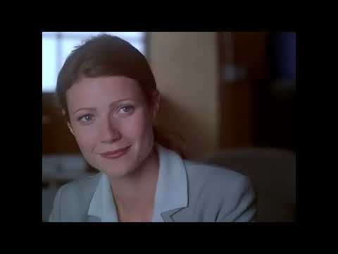 Bounce trailer close-up—two leads in conversation at night, city lights behind