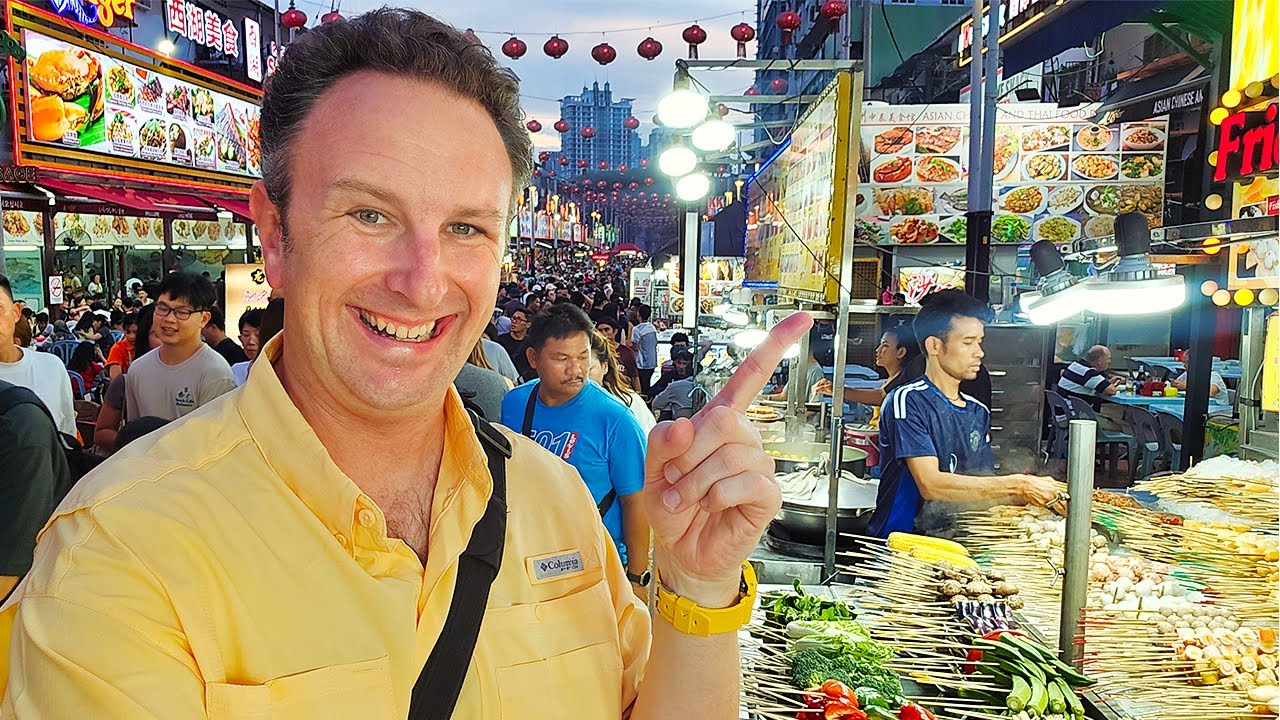 Join a traveler on an exciting exploration of Jalan Alor in this captivating video.