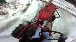 Plowing the driveway with a 1947-1949 vintage Farmall Cub