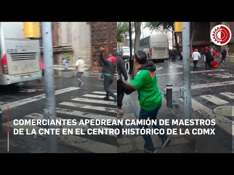 Comerciantes del Centro Histórico apedrean un camión de la CNTE en la Ciudad de México