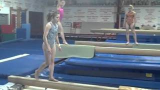 Rachel DiCarlo front toss on beam