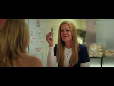 Trailer montage still of the Colleens working at the Eh-2-Zed counter, guitars propped nearby