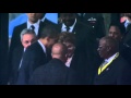 Raw: Obama and Castro Shake Hands at Service.