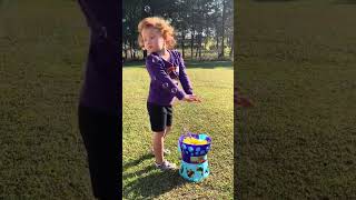 Kids playing with the bubble machine in the back yard ( October 13,2023 )