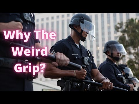 Why Do Riot Police Carry Their TONFA Clubs Like This?
