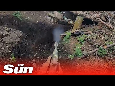Ukrainian soldiers storm Russian trenches with rifles near Bakhmut