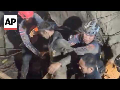 Rescuers evacuate 5 villagers found trapped in a Laos cave as 2 still missing