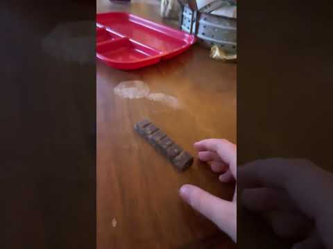 Eating Godiva roasted almond dark chocolate