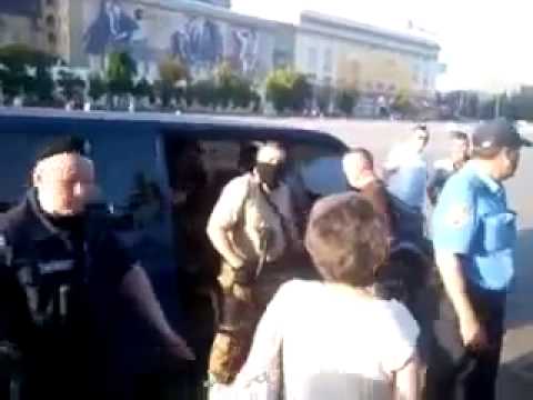 Kharkov, Ukraine, 20.4.2014: Police guarding masked, armed kidnapers