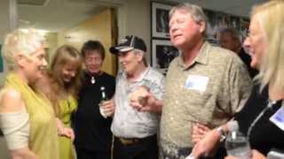 Rick Derringer, his wife Jenda and friends praying before his show.
