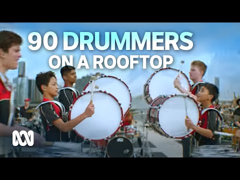 90 drummers light up the Brisbane skyline | ABC90