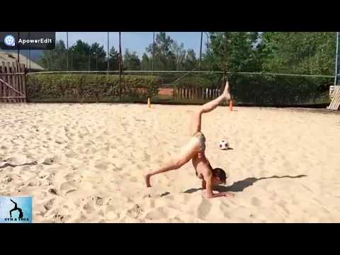 Girl 12 years training gymnastics in the sand 