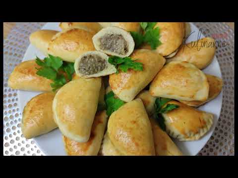 Baked yeast dumplings with mushrooms and cheese