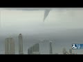 What is the difference between a tornado and a waterspout?