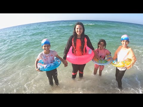 Shfa swims at sea with friends