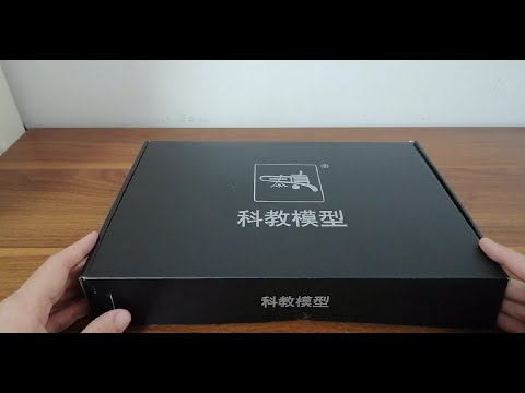 Middle aged man plays with toys: soft bullet gun unboxing