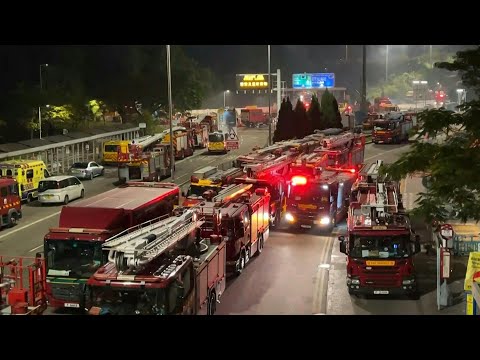Video | Hong Kong housing blocks still burning as firefighters work to control flames | AFP