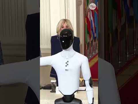 Melania Trump walks with humanoid robot at global summit