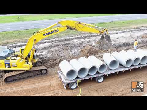 Komatsu PC360LC Excavator Laying Storm Sewer Pipe - McManus Construction - H&E Equipment Services
