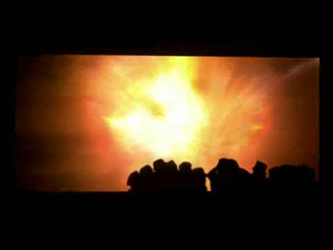 End-card flame and crowd from arena trailer, echoing the album’s climactic ‘Dead London’ release